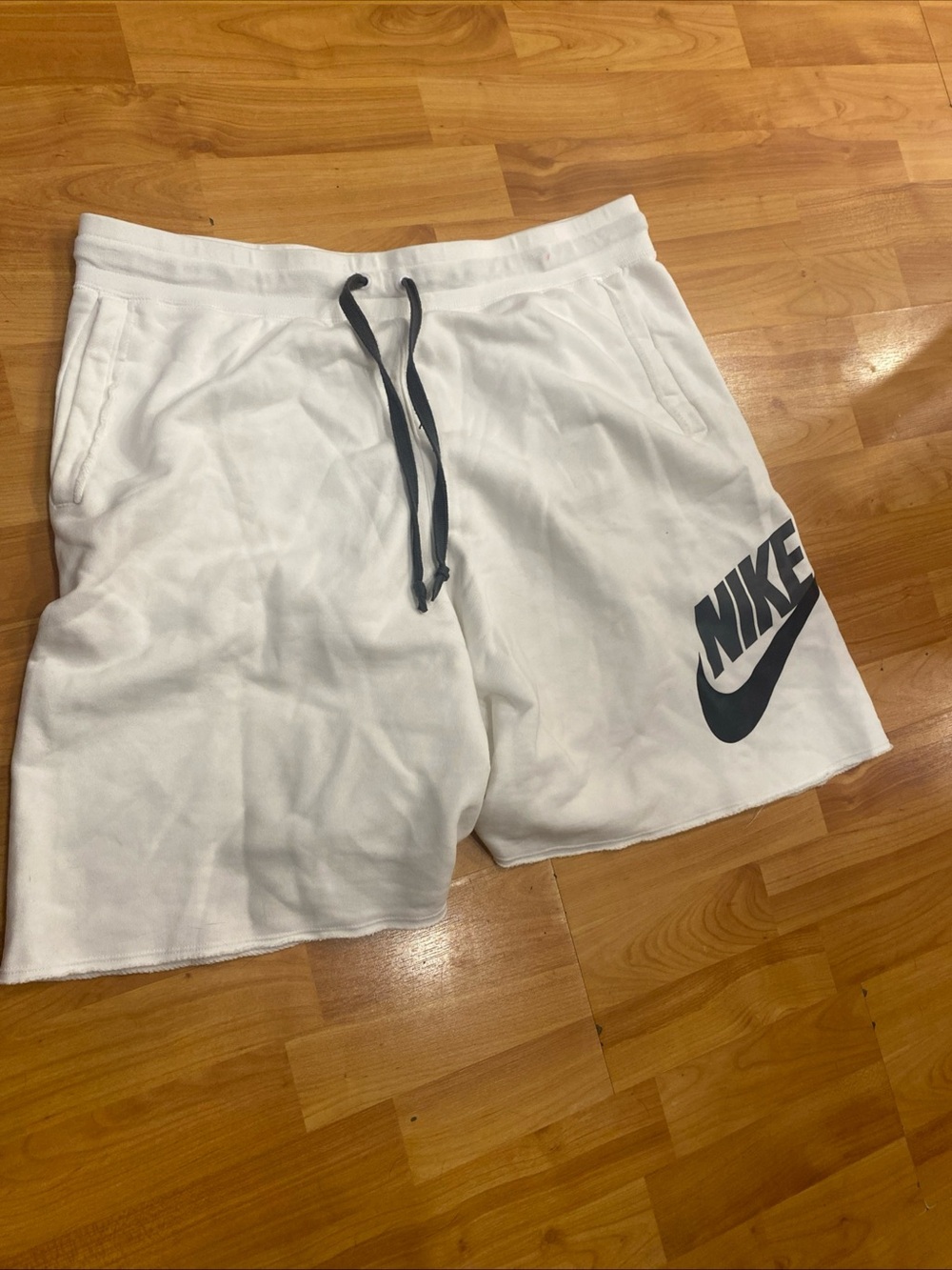 Nike Men’s White Athletic Shorts with Black Logo